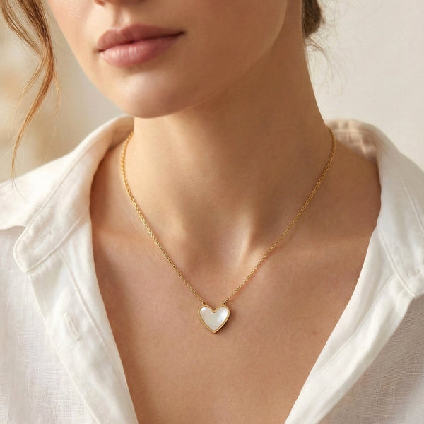 Mother of pearl heart pendant detailing with gold edges Evvara Vogue jewellery