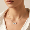 Luna Knot bow pendant with precision-cut stones and elegant gold finish by Evvara Vogue