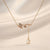Butterfly pearl drop pendant necklace in gold-tone stainless steel