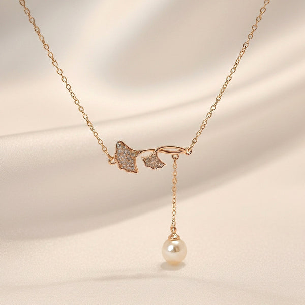 Butterfly pearl drop pendant necklace in gold-tone stainless steel