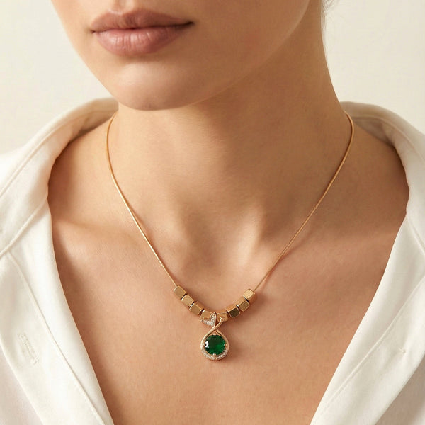 Emerald Frame stainless steel pendant with geometric gold detailing by Evvara Vogue
