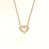 Evvara Twin Pulse minimalist heart necklace styled on soft satin background
