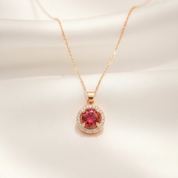 Scarlet Halo ruby red halo pendant in gold tone stainless steel by Evvara Vogue