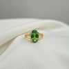 Emerald green oval stone anti-tarnish gold-tone ring