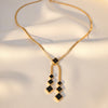 black square geometric pendants with gold chain detailing, Midnight Geometry necklace by Evvara Vogue