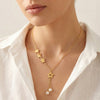 Gold tone star detailing with pearl drops in Evvara Vogue Starlace Drop necklace