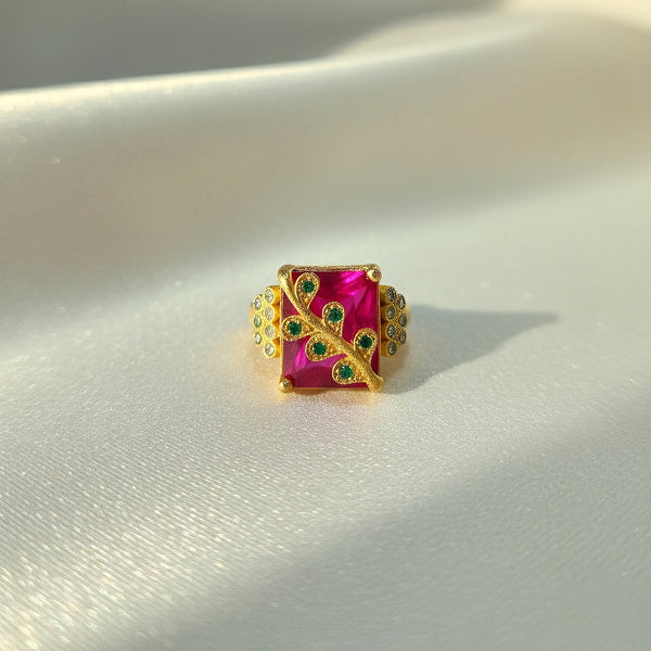 Square ruby tone statement ring with green stone detailing