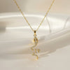 Serpent-inspired curved pendant with crystal detailing in gold finish anti-tarnish stainless steel