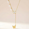 Minimal butterfly necklace layered with pearls elegant everyday jewellery design