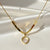 Halo Bloom clover pendant necklace in gold anti tarnish stainless steel by Evvara Vogue