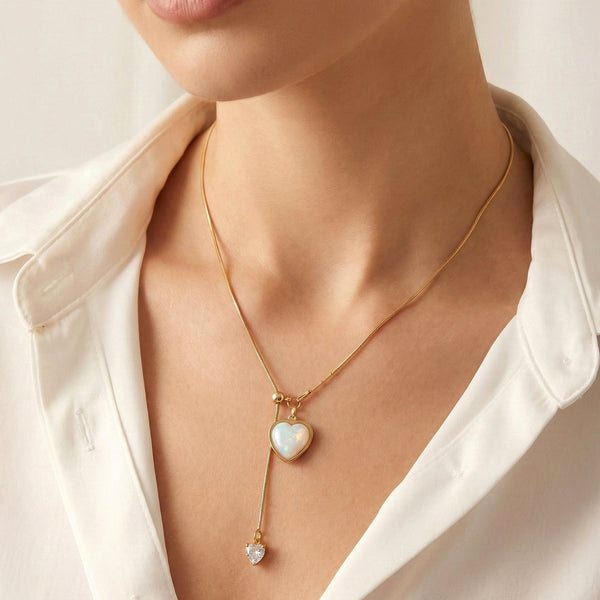 Close-up of gold heart drop pendant necklace with anti-tarnish finish by Evvara Vogue