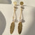 Elegant gold look earrings Evvara