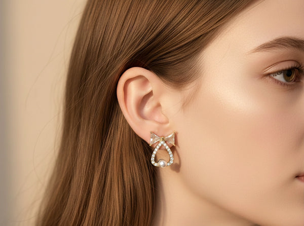 Elegant gold look bow earrings