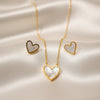 Pearlheart Whisper heart necklace in mother of pearl gold finish by Evvara Vogue