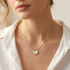 Mother of pearl heart pendant detailing with gold edges Evvara Vogue jewellery