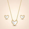 Elegant heart necklace and earrings set in mother of pearl by Evvara Vogue