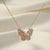 Aurélia Wing butterfly pendant necklace in gold finish with crystal detailing by Evvara Vogue