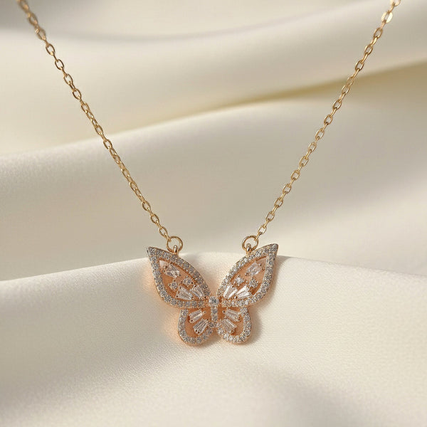 Aurélia Wing butterfly pendant necklace in gold finish with crystal detailing by Evvara Vogue