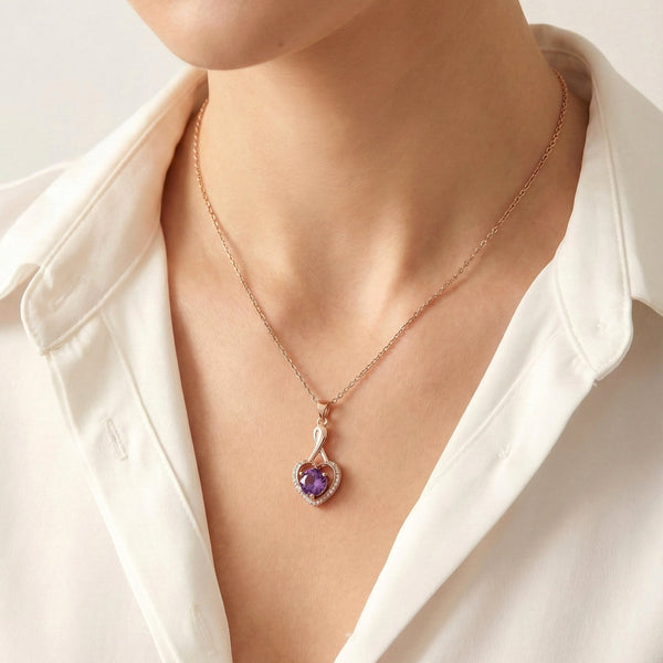 heart-shaped rose gold pendant with sparkling stones and purple gemstone