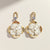Korean floral pearl drop earrings in gold tone