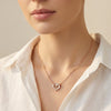 Evvara Twin Pulse heart pendant with pavé crystal detailing in rose gold finish