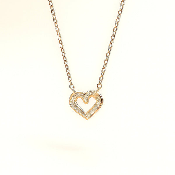 Evvara Twin Pulse minimalist heart necklace styled on soft satin background