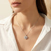 Close-up of layered heart crystal pendant in silver finish by Evvara Vogue