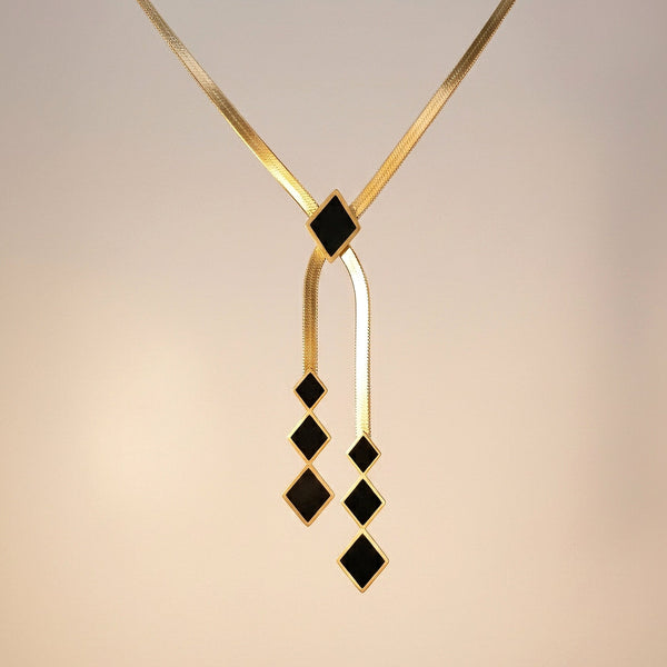 Midnight Geometry black geometric drop necklace in gold finish, anti-tarnish stainless steel by Evvara Vogue