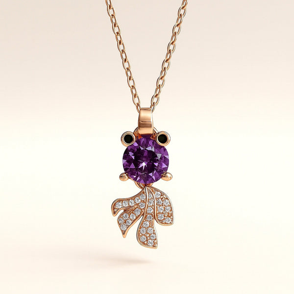 Minimal gold-tone Nocturne Muse pendant styled on soft fabric – Evvara Vogue jewelry