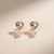 Heart crystal pearl drop earrings in gold tone
