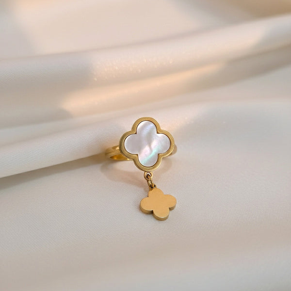clover ring with mother-of-pearl and dangling charm worn on hand – Evvara Vogue