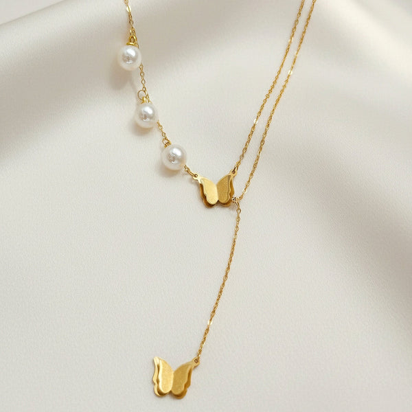 Golden Drift butterfly necklace in anti tarnish stainless steel with pearls by Evvara Vogue