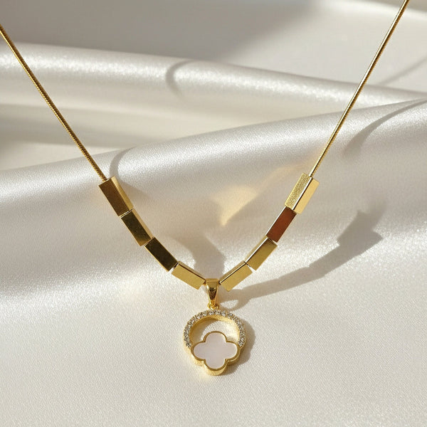 Halo Bloom clover pendant necklace in gold anti tarnish stainless steel by Evvara Vogue