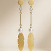 Gold-tone leaf pearl long drop earrings