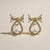 Gold tone bow pearl crystal stud earring