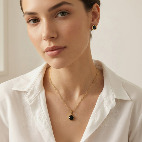Black stone pendant set with matching stud earrings 